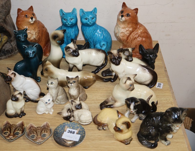 A collection of assorted pottery cats to include Beswick, Poole and Wade